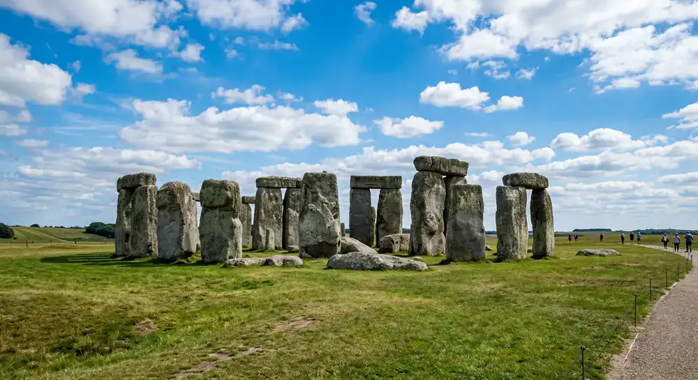 The ancient monolithic circle of Stonehenge against a bright sky
